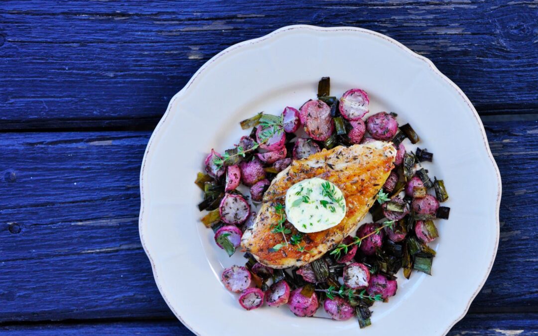 Oven baked chicken breast and radishes with thyme butter