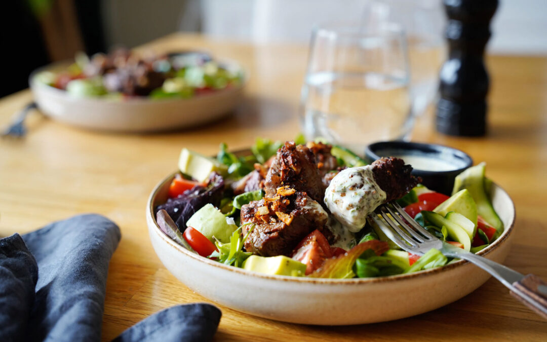Garlic steak bite salad with tarragon dressing