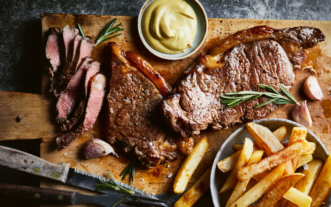 Steak, chips with garlic, and rosemary butter